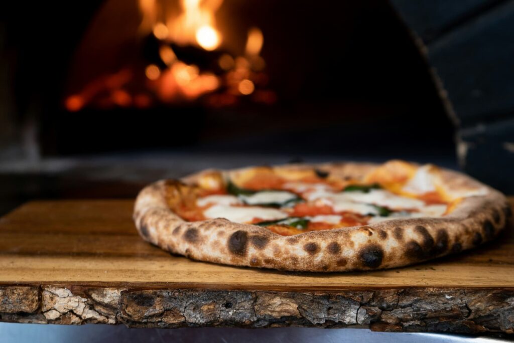 fresh pizza out of the oven